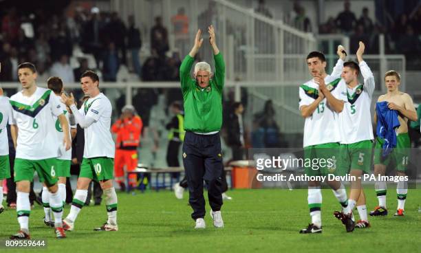 Northern Ireland manager Nigel Worthington applauds the traveling fans following his final game in charge during UEFA Euro 2012 Qualifying match at...