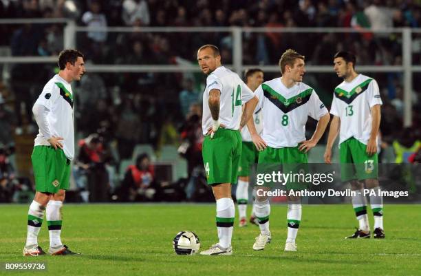 Northern Ireland players appear dejected after Italy's Federico Balzaretti scored their third goal during UEFA Euro 2012 Qualifying match at the...