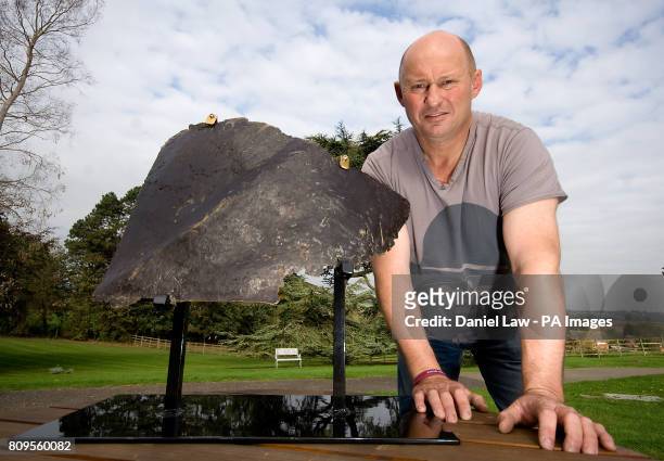Nigel 'Spud' Ely founder of Trebletap War Relic Art, and former 22nd Special Air Service soldier, with the left buttock of the Saddam Hussein statue,...