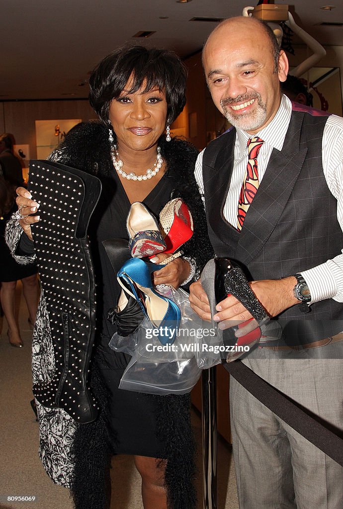 Singer Patti LaBelle is greeted by designer Christian Louboutin at