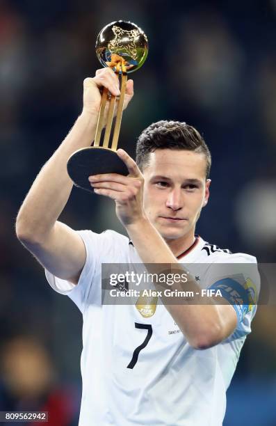 Julian Draxler of Germany poses with the adidas Golden Ball award after the FIFA Confederations Cup Russia 2017 final between Chile and Germany at...