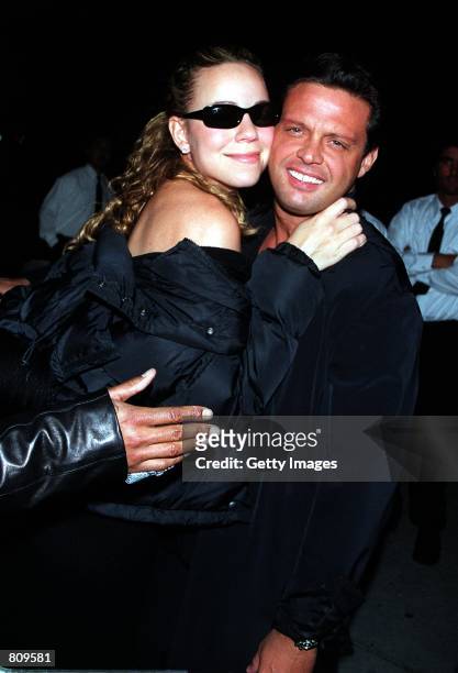 Singer Mariah Carey and Luis Miguel arrive at Mr. Chow's restaurant February 18, 2001 in Beverly Hills, CA.
