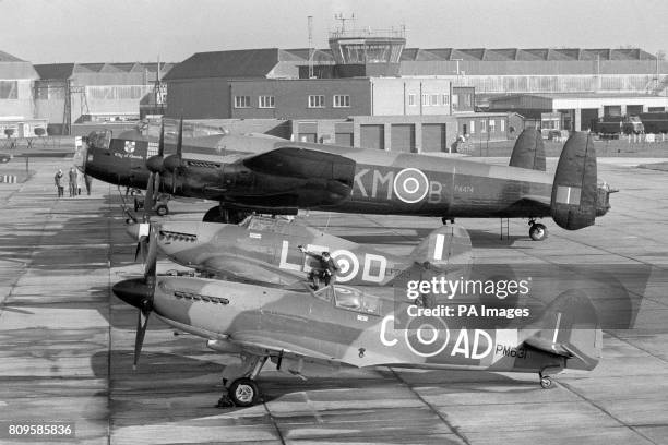 The planes of the Royal Air Force's famous "Battle of Britain Memorial Flight" sit on the runway at RAF Coltishall. The planes a Spitfire, Hurricane...