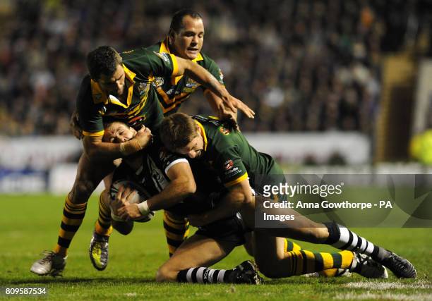 New Zealand's Jason Nightingale is tackled by Australia's Cameron Smith and Chris Lawrence during the Gillette Four Nations match at the Halliwell...