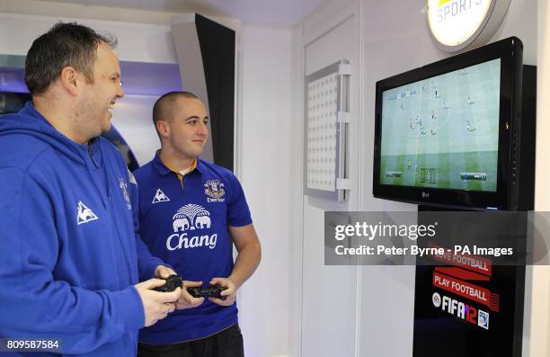 Fans play FIFA12 in the EA Sports promotional trailer outside of Goodison Park