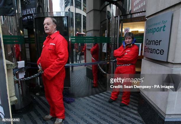 Greenpeace protesters block the entrance to the Department for Transport in Horseferry Road, London, after they claimed documents released showed how...