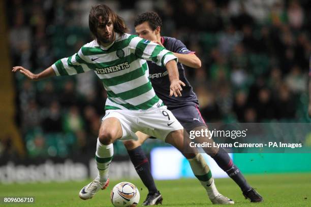 Celtic's Georgios Samaras and Stade Rennes' Vincent Pajot battle for the ball during the UEFA Europa League match at Celtic Park, Glasgow.