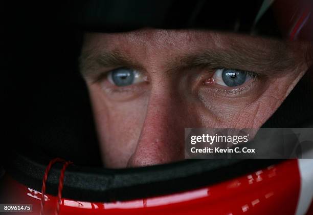 Carl Edwards, driver of the Office Depot Ford, sits in his car in the garage during practice for the NASCAR Sprint Cup Series Crown Royal Presents...