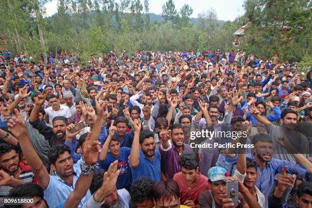 People shout pro freedom slogan during the funeral prayers of Jehangir Ahmad Khanday of Keller area of Shopian district. Six homes were destroyed...