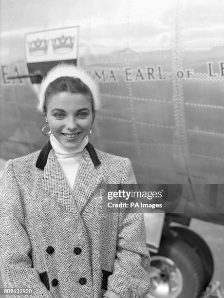 Film actress Joan Collins at London Airport as she was about to leave in a BEA Elizabethan liner for Barcelona on her way to Majorca for location...