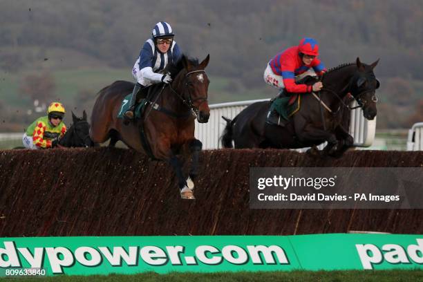 Jockey Tony McCoy on Teaforthree and Sam Twiston-Davies on Viking Blond during the Ultima Frontrunner In It Solutions Novices' Chase