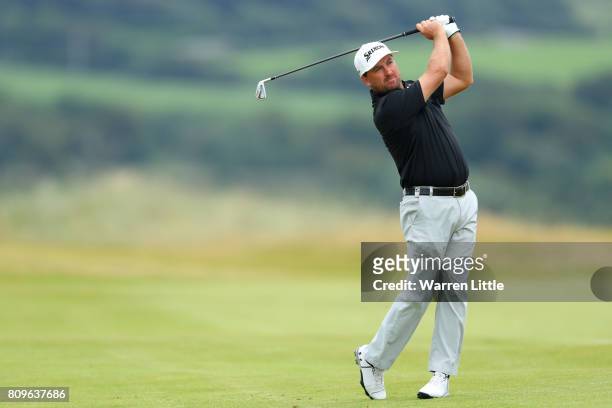 Graeme McDowell of Northern Ireland hits his second shot on the 18th hole during day one of the Dubai Duty Free Irish Open at Portstewart Golf Club...