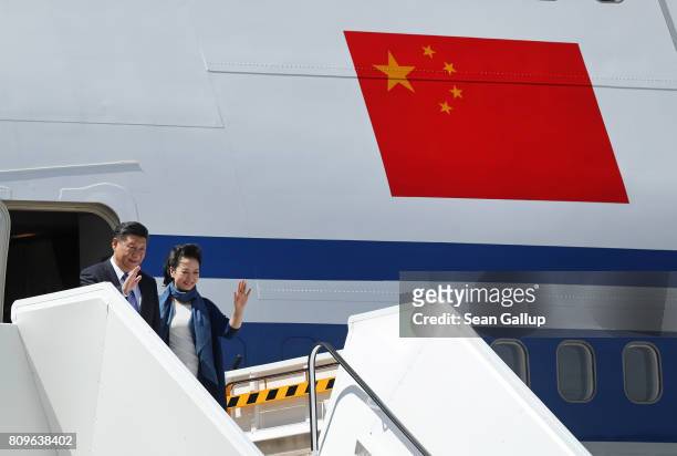 Chinese President Xi Jinping and First Lady Peng Liyuan arrive at Hamburg Airport for the Hamburg G20 economic summit on July 6, 2017 in Hamburg,...