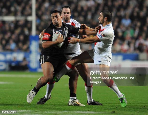 New Zealand's Sika Manu is tackled by England's Adrian Morley and Rangi Chase during the Gillette Four Nations match at the Kingston Communications...