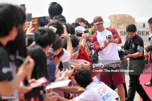 Vissel Kobe new player Lukas Podolski greets fans on arrival at kObe Airport on July 6, 2017 in Kobe, Hyogo, Japan.