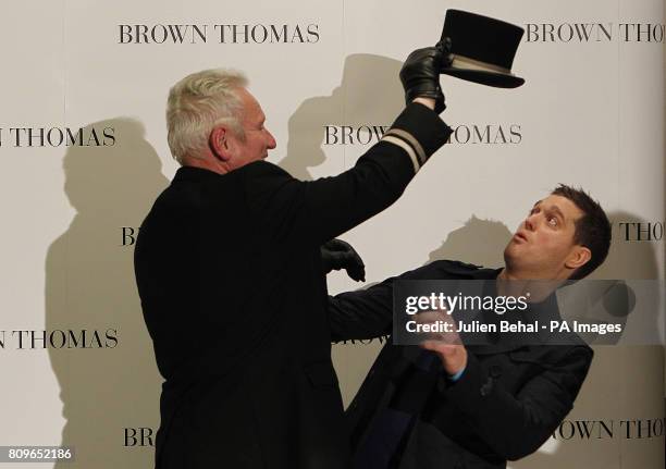 Canadian artist Michael Buble poses with Brown Thomas doorman Ciaran Bass in the famous Dublin department store during his visit to Dublin to promote...