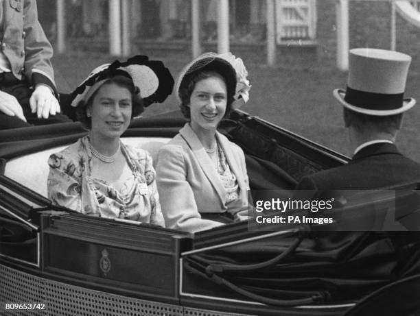 Princess Elizabeth, left, and Princess Margaret as they arrived at the grandstand for the third day of the Ascot race meeting.