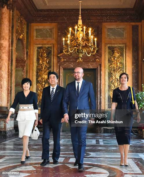 Prime Minister Shinzo Abe and his wife Akie walk with Belgium Prime Minister Charles Michel and his partner Amelie Derbaudrenghien prior to their...