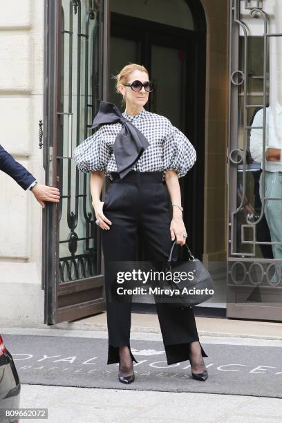Singer Celine Dion seen wearing Dice Kayek top, Celine pants, Tom Ford shoes and bag from Celine Dion Collection on July 6, 2017 in Paris, France.