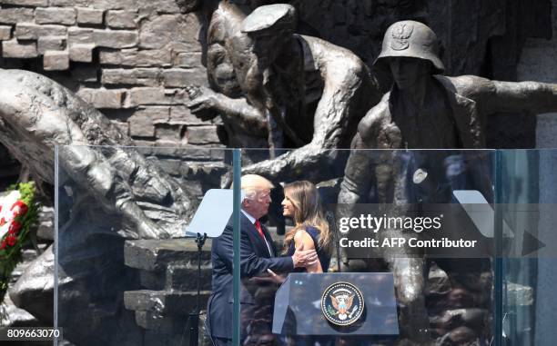 President Donald Trump hugs his wife Melania Trump after she gave a speech in front of the Warsaw Uprising Monument on Krasinski Square during the...