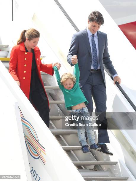 Canadian Prime Minister Justin Trudeau, his wife Sophie Gregoire and son Hadrien arrive at Hamburg Airport for the Hamburg G20 economic summit on...