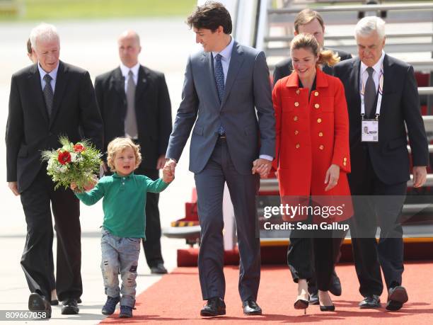 Canadian Prime Minister Justin Trudeau, his wife Sophie Gregoire and son Hadrien arrive at Hamburg Airport for the Hamburg G20 economic summit on...