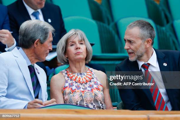 British Michelin starred chef Michel Roux and his wife Giselle sit in the royal box on Centre Court as France's Gael Monfils play against Britain's...