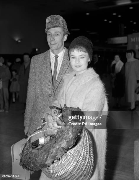 John Neville and Judi Dench at London Airport on their return by BEA charter liner from Jugoslavia with the Old Vic Theatre Company which presented...