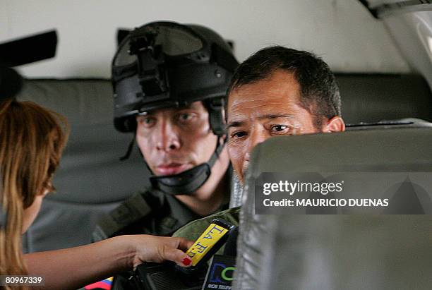 Drug lord Miguel Angel Mejia Munera answers questions to journalists into an airplane on May 02 in Mariquita, Department of Tolima, Colombia. Miguel...