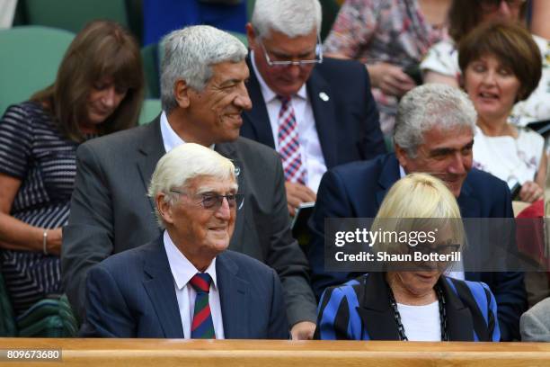 Sir Michael Parkinson and Lady Mary Parkinson look on from the centre court royal box on day four of the Wimbledon Lawn Tennis Championships at the...