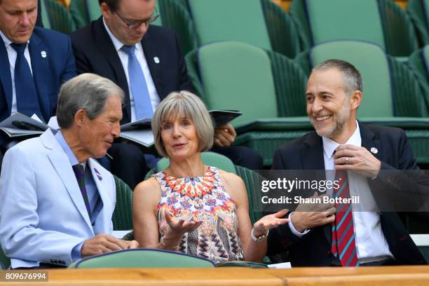 Michel Roux Jr, his wife Giselle and Anthony Henman look on from the centre court royal box on day four of the Wimbledon Lawn Tennis Championships at...