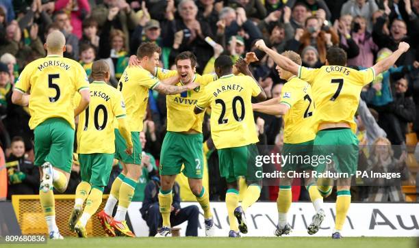 Norwich City's Russell Martin celebrates with team-mates after scoring his team's opening goal