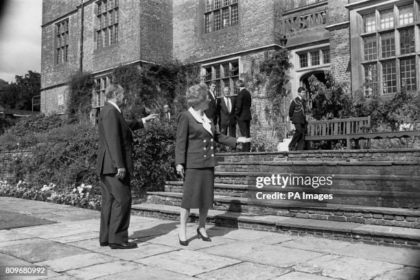 Prime Minister Margaret Thatcher and French President Francois Mitterrand indicate the flower borders at Chequers which they discussed when she...