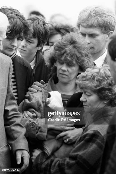 Patrick Kelly's widow, Kathleen Kelly walks from her home on the Lisnahull Estate in Dungannon after four masked men had carried the coffin of her...