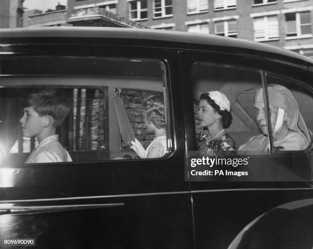 Queen Elizabeth II, Prince Charles, Princess Anne and Princess Andrew of Greece , in the Royal car as they arrived at Tower Pier, London, to pay a...