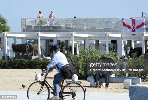 Locals look-on as Northern Ireland fans enjoy the warm weather ahead of the Euro 2012 qualifier between Italy and Northern Ireland in Pescara, Italy,