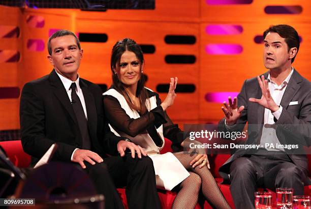 Antonio Banderas, Salma Hayek and Jimmy Carr share a joke during the filming of the Graham Norton Show at The London Studios, south London, to be...