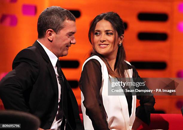 Antonio Banderas and Salma Hayek share a joke during the filming of the Graham Norton Show at The London Studios, south London, to be aired on BBC...
