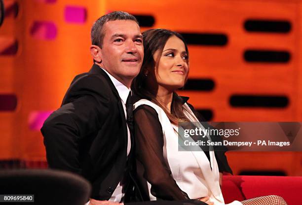 Antonio Banderas and Salma Hayek share a joke during the filming of the Graham Norton Show at The London Studios, south London, to be aired on BBC...