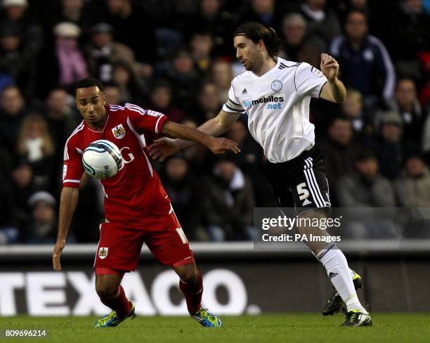 Bristol City's Nicky Maynard and Derby County's Shaun Barker battle for possession of the ball during the npower Football League Championship match...