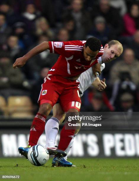 Bristol City's Nicky Maynard holds the ball up under pressure from Derby County's Gareth Roberts during the npower Football League Championship match...