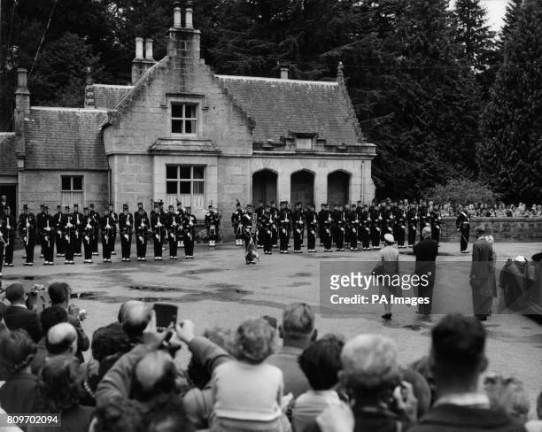American President Dwight D. Eisenhower stands with Queen Elizabeth II, the Duke of Edinburgh, and Princess Anne, at the gates of Balmoral Castle as...