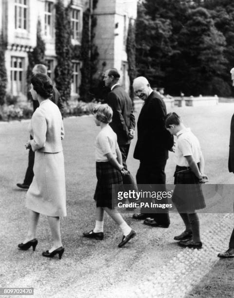 American President Dwight D. Eisenhower walks with Queen Elizabeth II, the Duke of Edinburgh, Princess Anne and the Prince of Wales at Balmoral. Also...