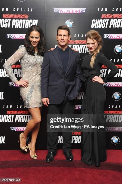 Paula Patton, Tom Cruise and Lea Seydoux arriving for the UK premiere of Mission:Impossible Ghost Protocol, at the BFI IMAX, Waterloo, London.