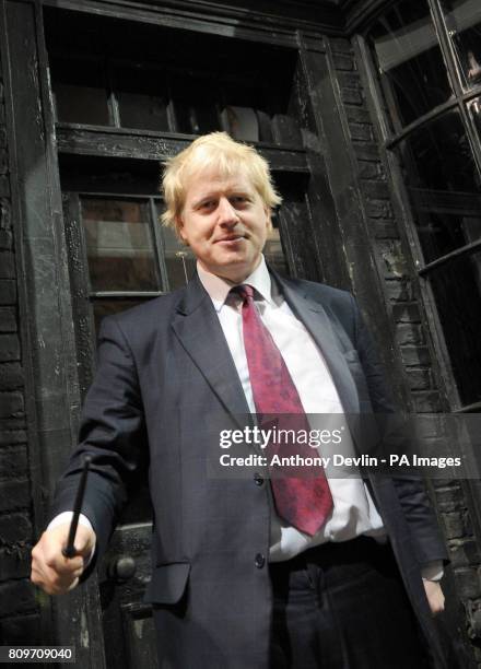 Mayor of London Boris Johnson waves a wand in Diagon Alley as he visits the new attraction 'The Making of Harry Potter' at Warner Brothers studios in...