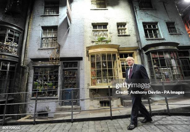 Mayor of London Boris Johnson walks down Diagon Alley as he visits the new attraction 'The Making of Harry Potter' at Warner Brothers studios in...