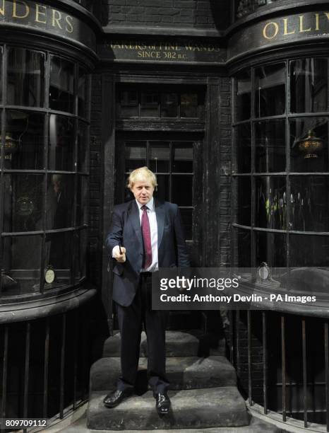 Mayor of London Boris Johnson waves a wand in Diagon Alley as he visits the new attraction 'The Making of Harry Potter' at Warner Brothers studios in...