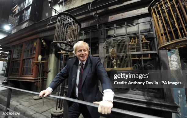 Mayor of London Boris Johnson poses on Diagon Alley as he visits the new attraction 'The Making of Harry Potter' at Warner Brothers studios in...