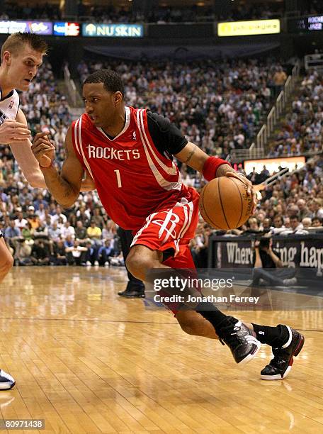 Tracy McGrady of the Houston Rockets drives on Andrei Kirilenko of the Utah Jazz in Game Six of the Western Conference Quarterfinals during the 2008...