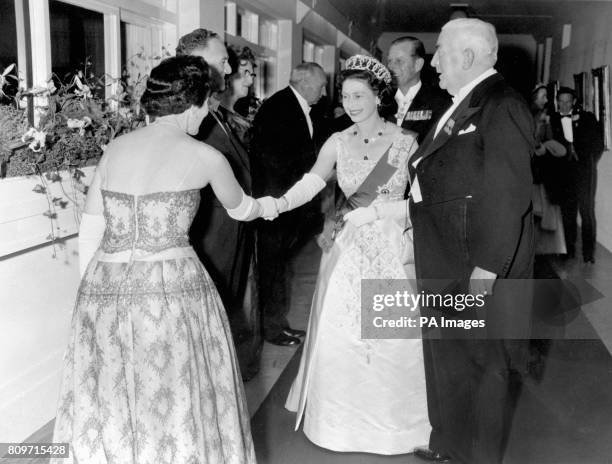 Guest is presented to Queen Elizabeth II at the State reception in Parliament House, Canberra, which was the climax of the first day of the Royal...